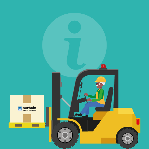 Man in forklift picking up box